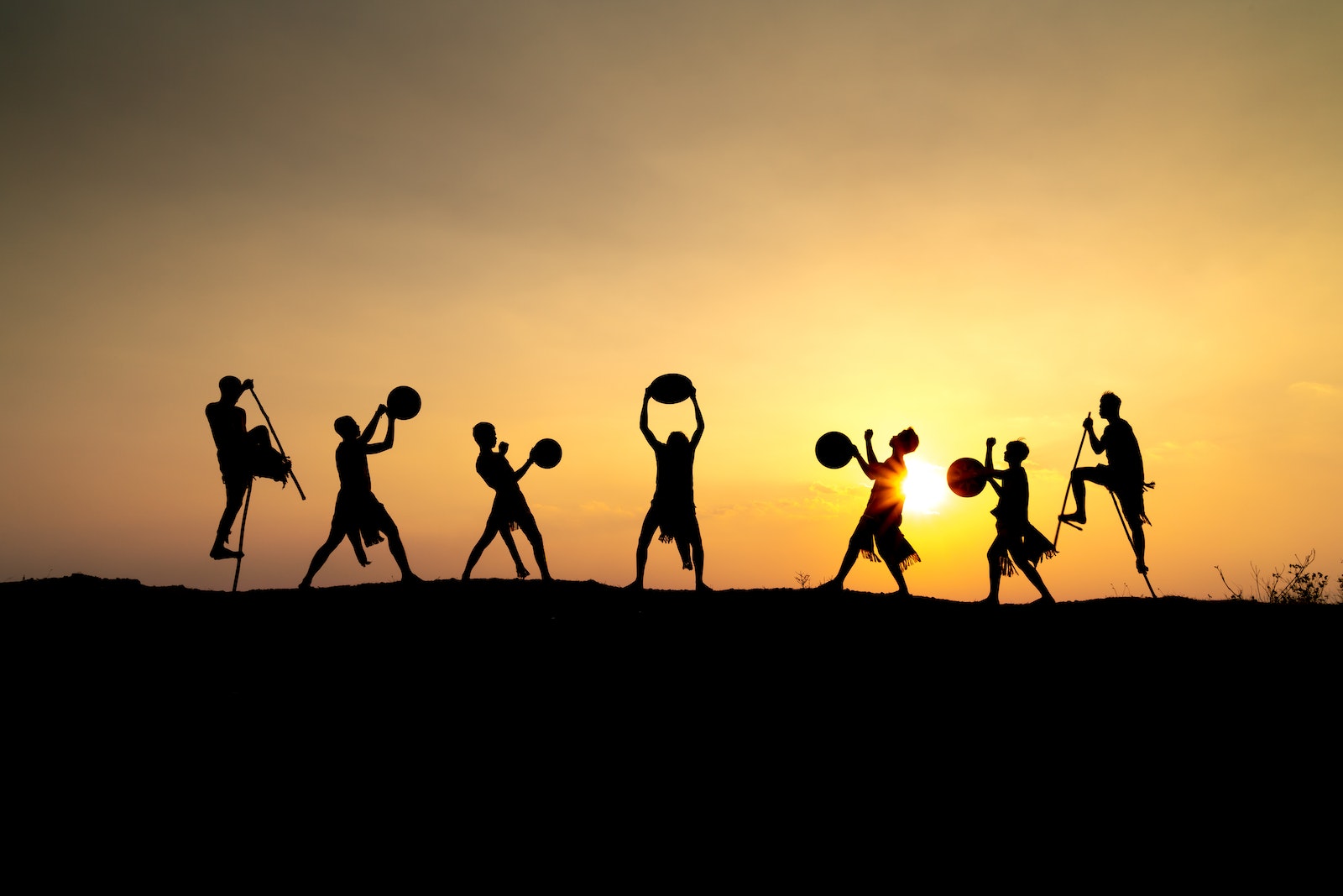 People Dancing at Sunset